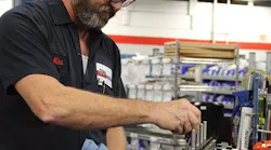 cnh_reman_michael_hayden_installing_push_rods_spri