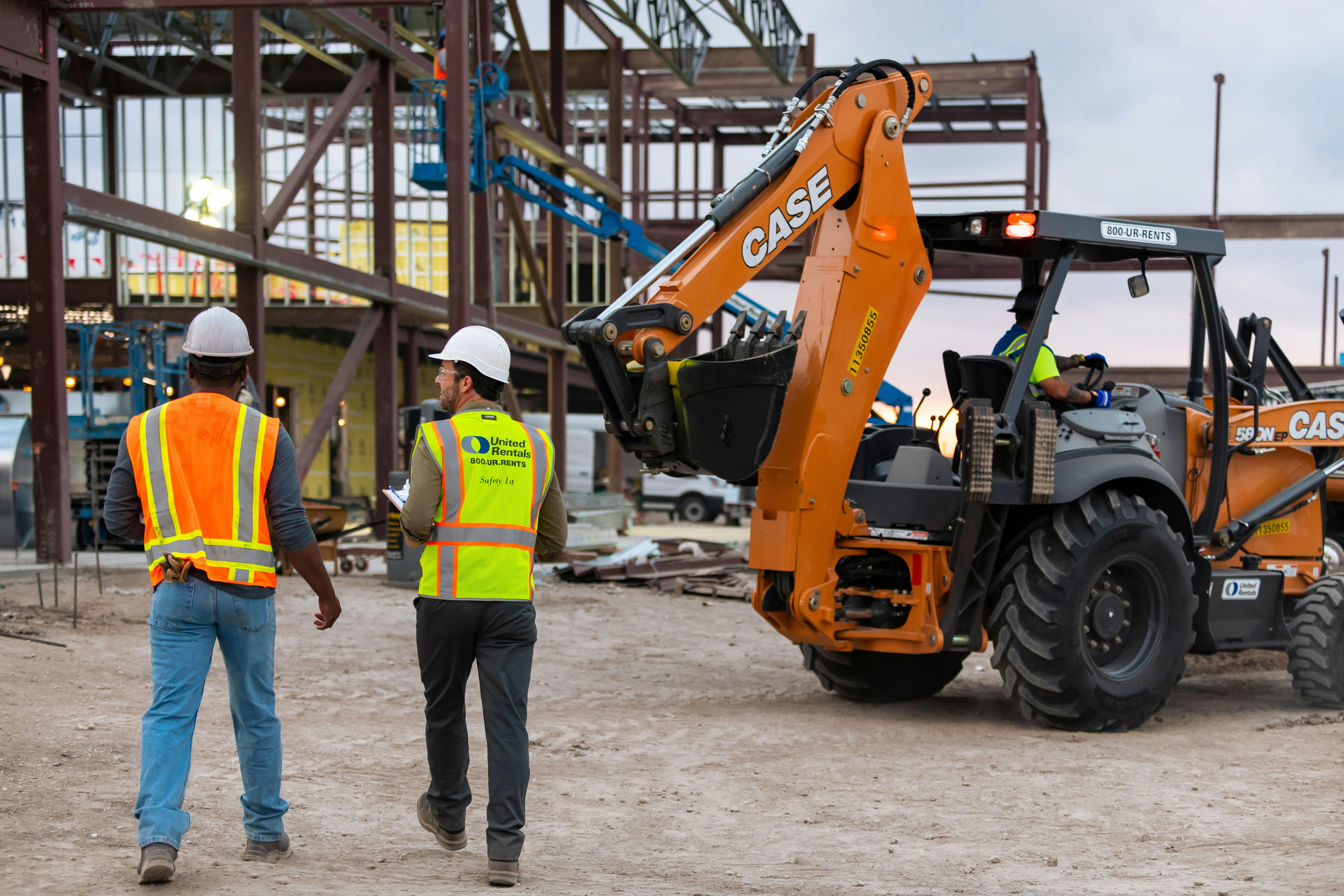 67a04de6eef66c6597b8183e United Rentals Dudes On Job Site With Case Unit
