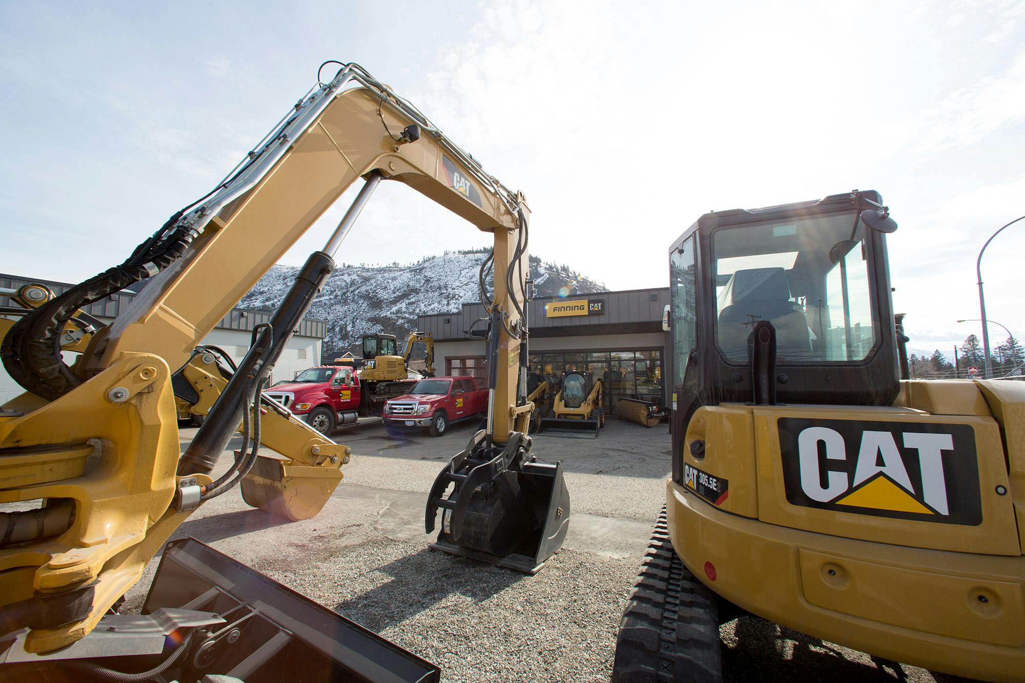 67b6bcbd935a90fa3b037596 Finning 2 Rental Equipment Store In Background
