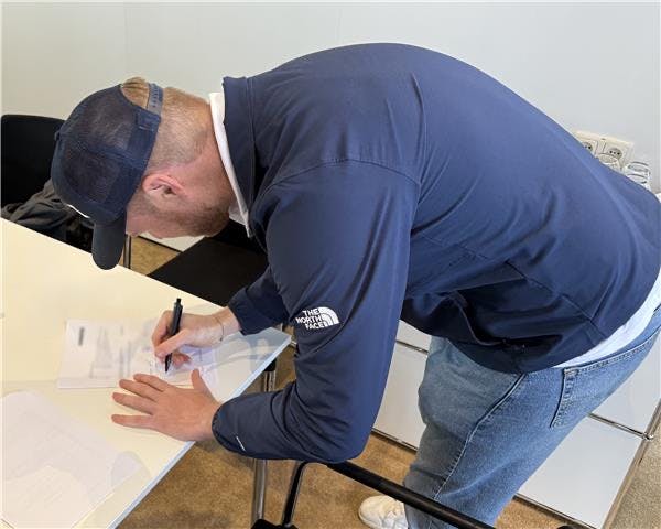 67fd283ce325d529db2c1eae Bigge Picture Of A Guy Writing Something Down 425