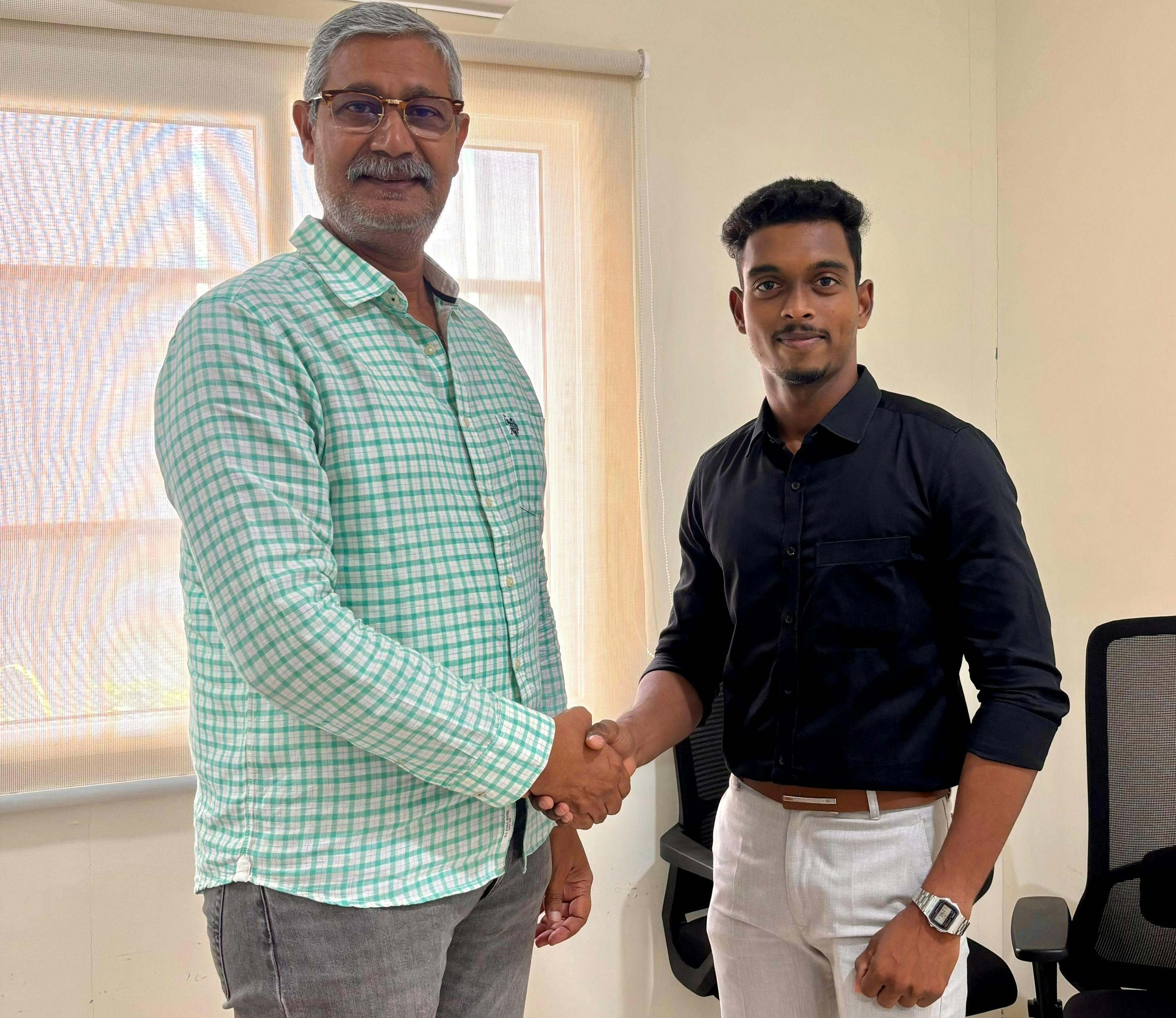 Desababu Koduru, vice president of operations, Bheemaa Infra Solutions, left, meets with Chaitanya Emandi, regional sales manager, South India, MyCrane.