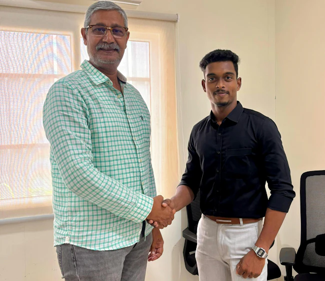 Desababu Koduru, vice president of operations, Bheemaa Infra Solutions, left, meets with Chaitanya Emandi, regional sales manager, South India, MyCrane.