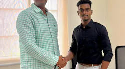 Desababu Koduru, vice president of operations, Bheemaa Infra Solutions, left, meets with Chaitanya Emandi, regional sales manager, South India, MyCrane.