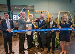 Left to Right: Cutting the ribbon with Toyota Material Handling North America chief supply officer Tony Miller, Indiana governor Mike Braun, Columbus mayor Mary Ferdon, TMHNA president & CEO Brett Wood, TICO president Koichi Ito, and Rep. Erin Houchin.