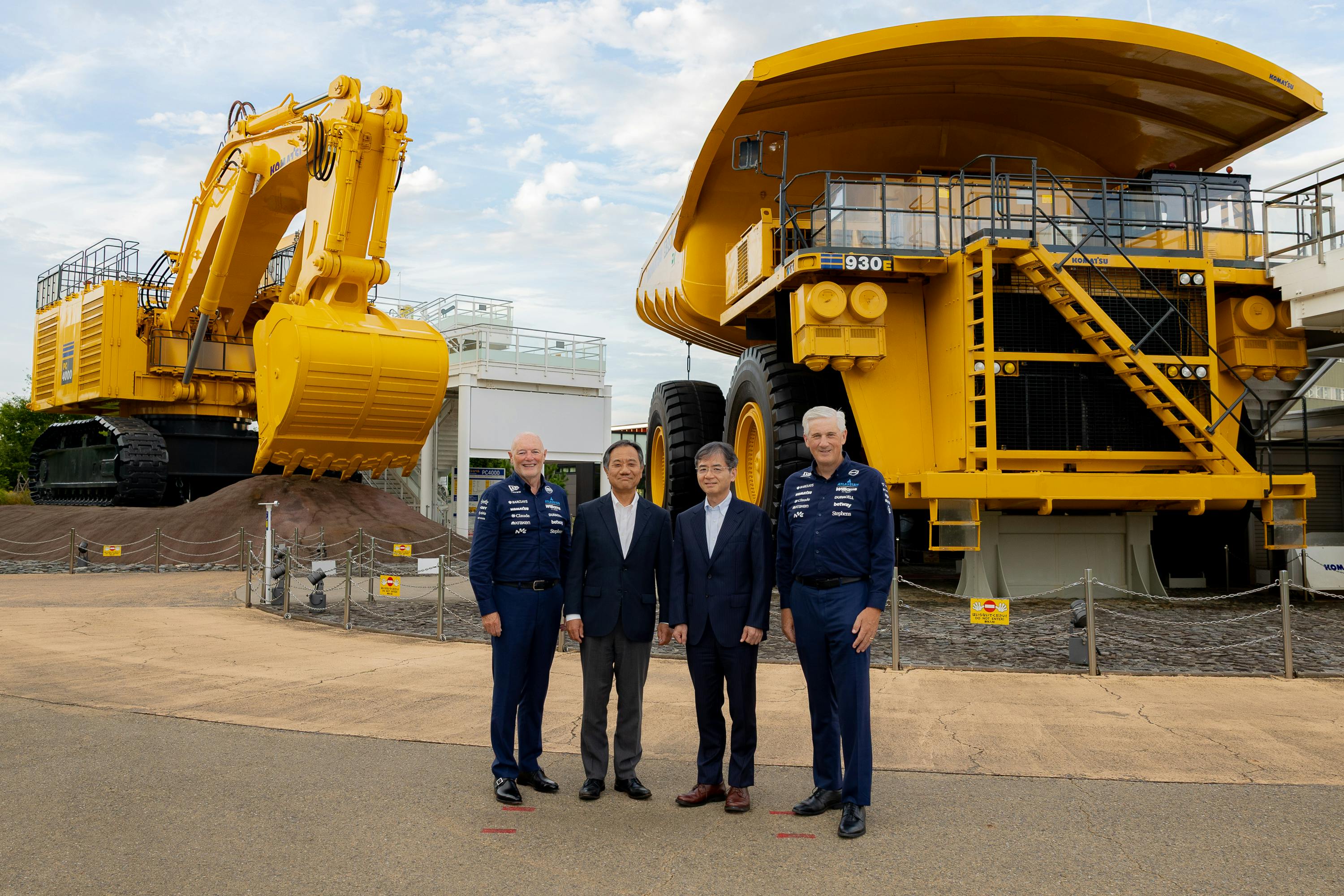 From left: Peter Kenyon, Board Adviser, Atlassian Williams F1 Team; Matthew Savage, Chairman, Atlassian Williams F1 Team; Takuya Imayoshi, President and CEO, Komatsu Ltd.; and Yasuji Nishiura, Senior Executive Officer, Komatsu Ltd., at the partnership extension signing ceremony Sept. 2 in Komatsu City, Japan.