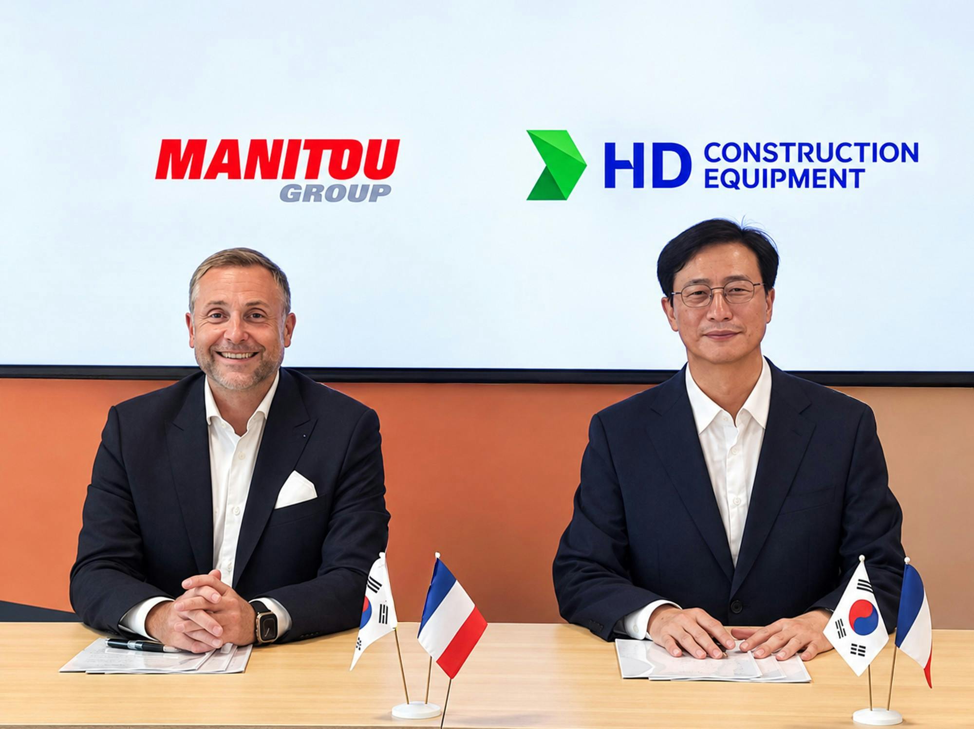 Manitou's Sylvain Blaise and HD Construction Equipment's Jaeyoung Moon at the signing of the agreement.